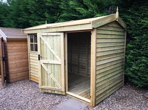A 10ft x 6ft Malvern Heavy Duty Pavilion shed in Barnstyle cladding.